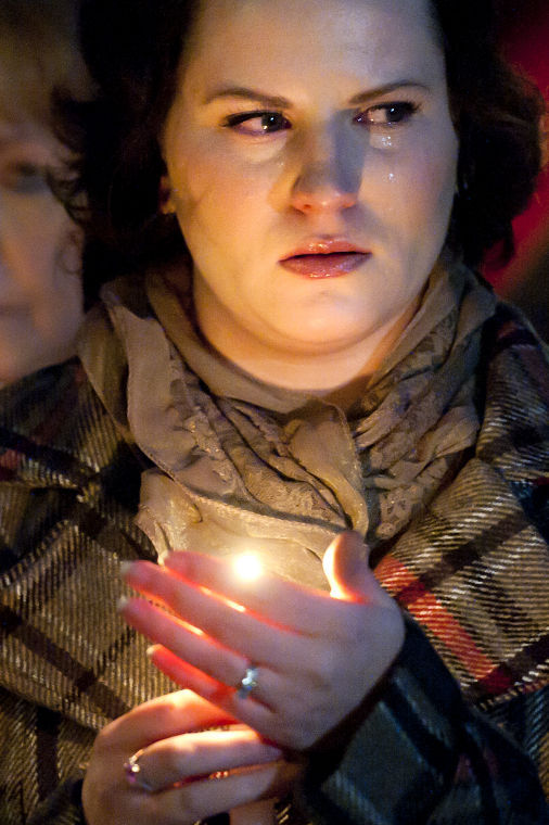 Candlelight vigil remembers eight killed in 2010 slaying